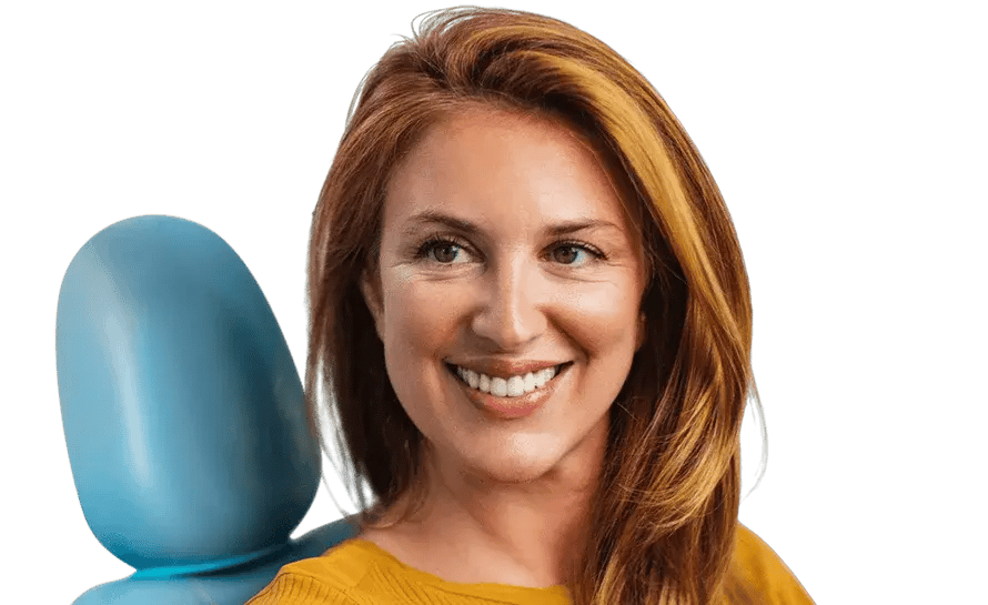 woman-smiling-in-dental-chair-890x545