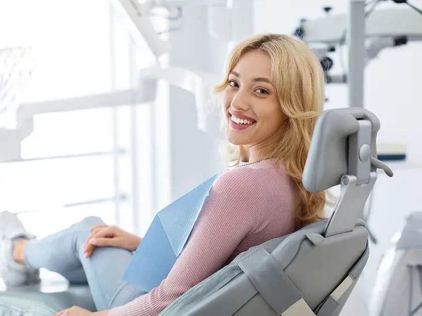 young-woman-smiling-during-exam-840x628